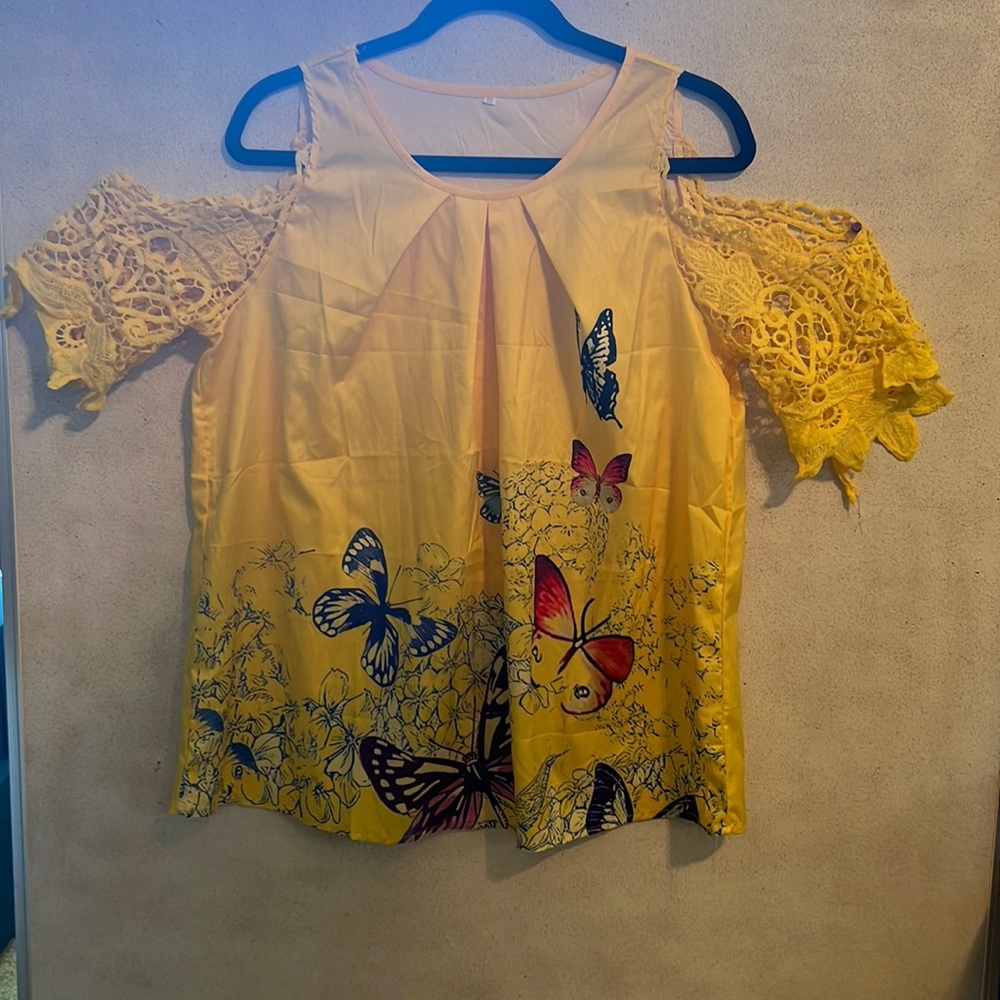 Yellow butterfly blouse. Never worn. Has butterfly sleeves. Runs sm for a XXL.